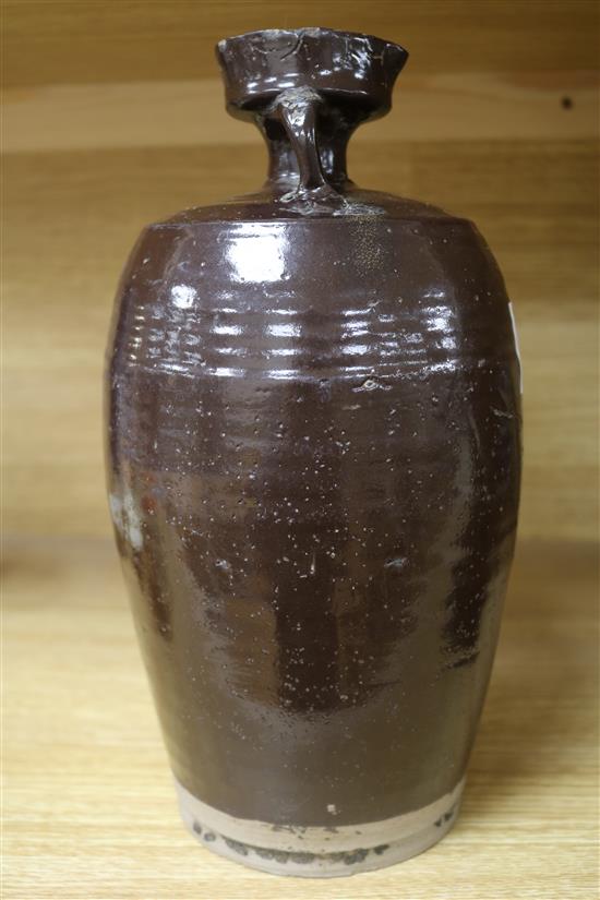 A Chinese late Ming brown glazed spouted jar